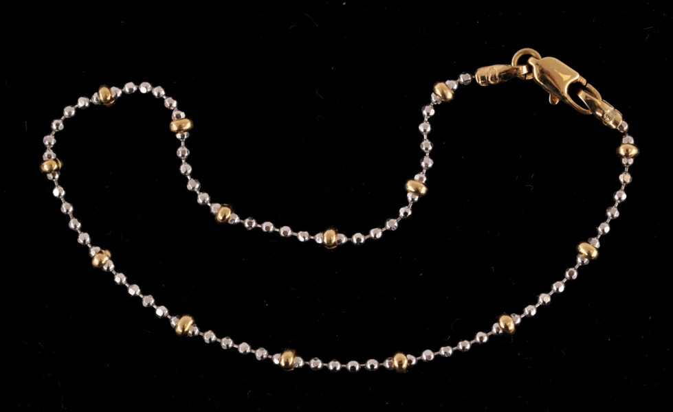 Armband i 18k röd- samt vitguld