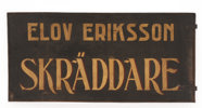 Fasadskylt, "Elov Ericsson Skräddare", 1900-talets första del