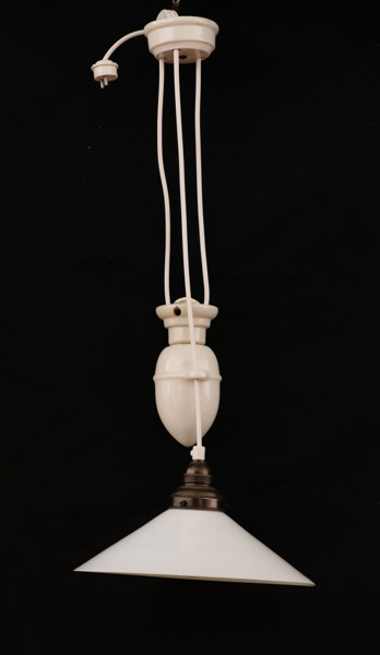 Skomakarlampa med hiss, 1900-talets början