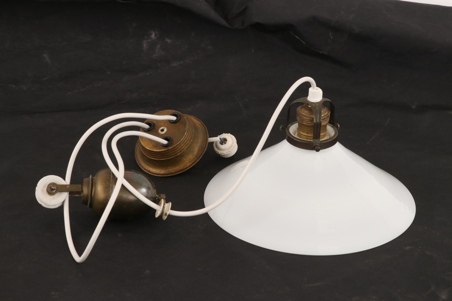 Skomakarlampa med hiss, 1900-talets första del