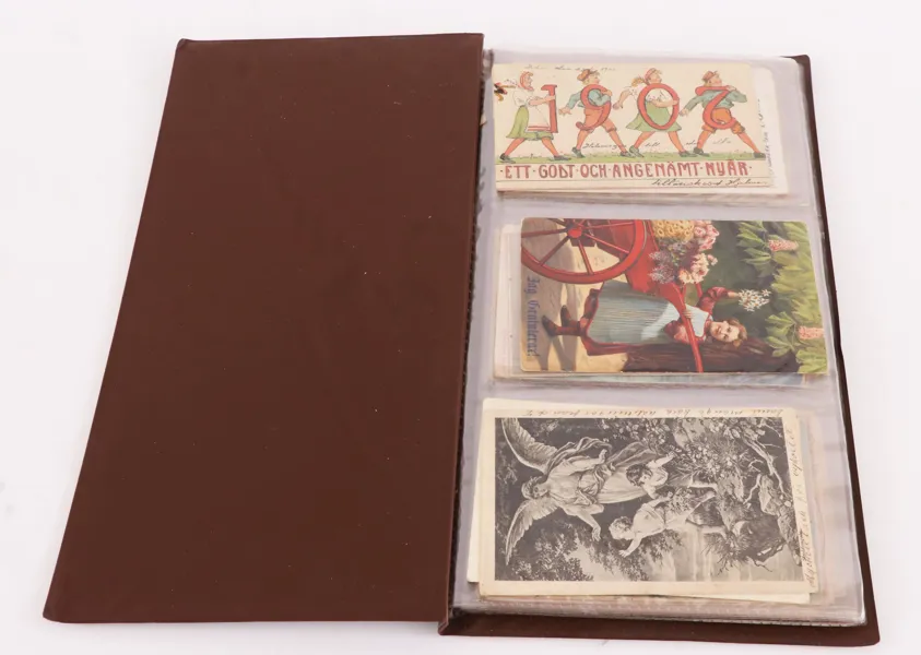 Album med vy- och gratulationskort 60st, mestadels 1900-talets början